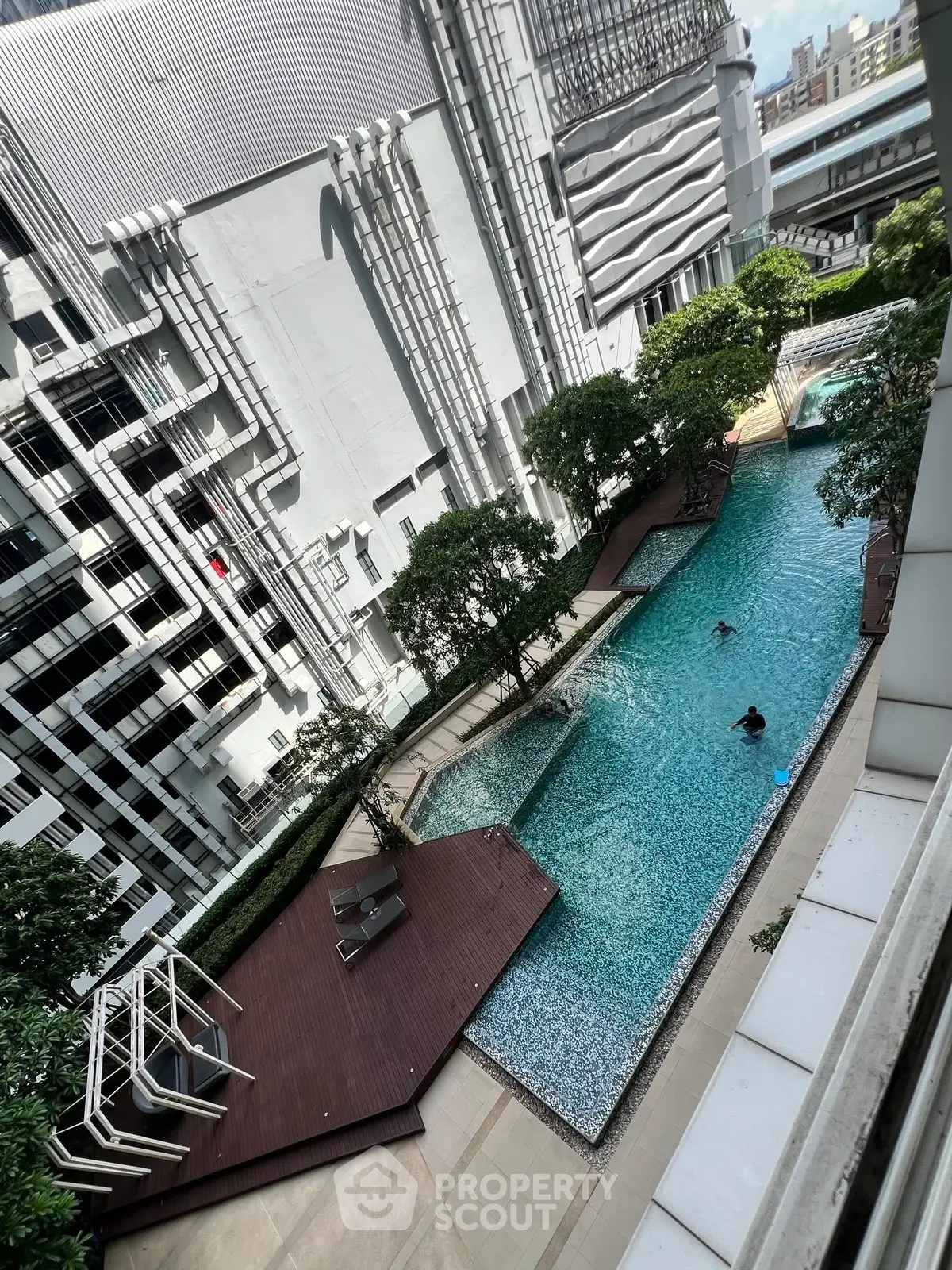 Luxurious urban apartment with stunning rooftop pool and city views.