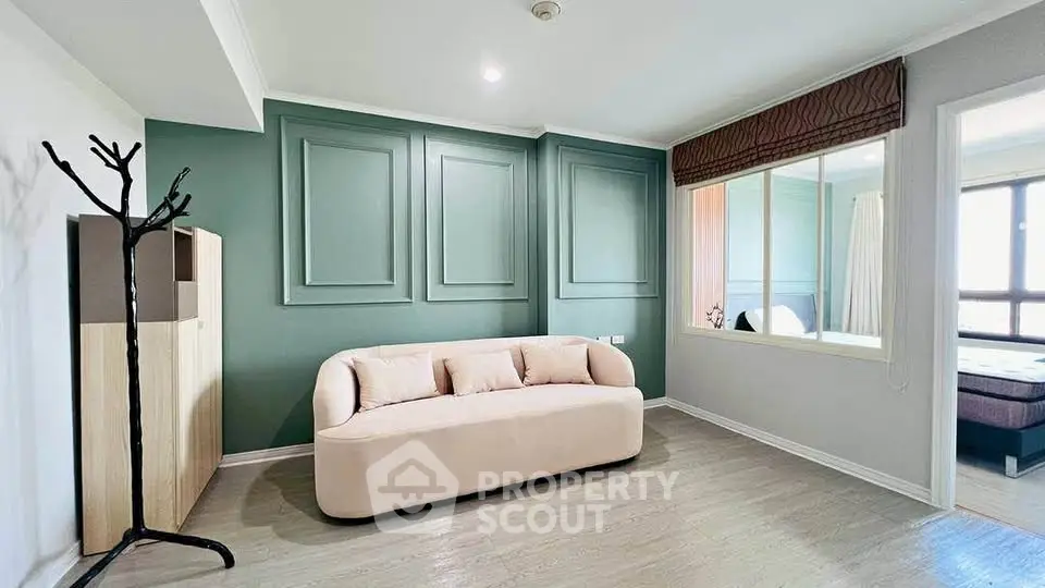 Modern living room with stylish sofa and elegant wall paneling