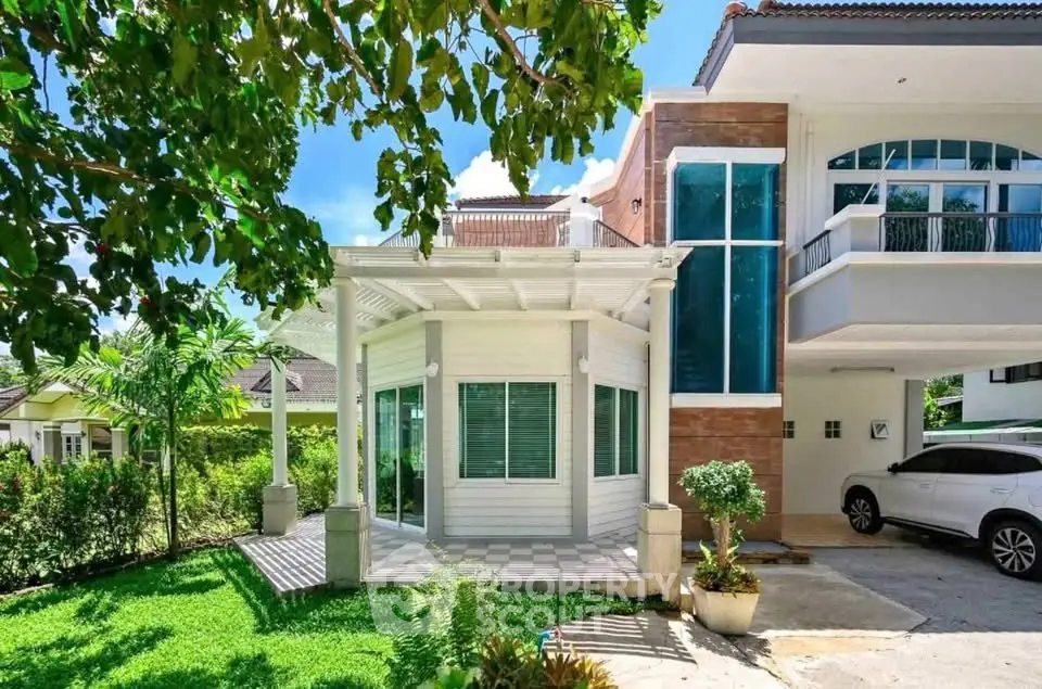 Stunning modern home with lush garden and spacious carport, perfect for family living.