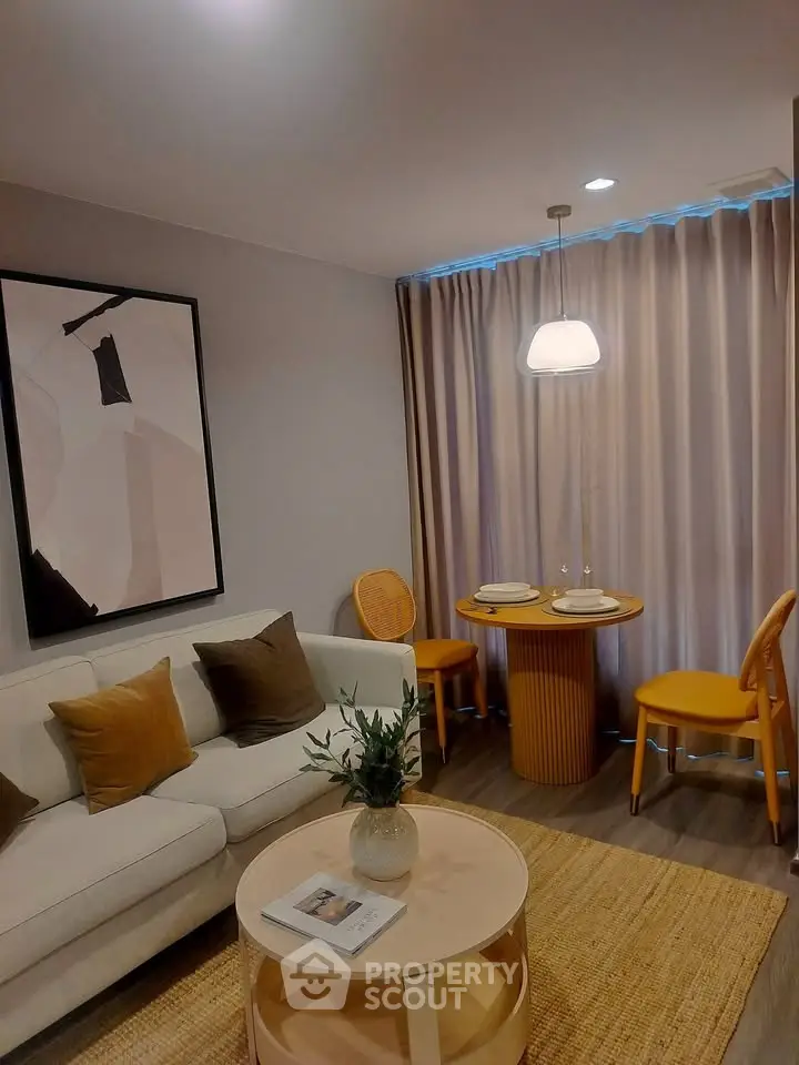 Chic modern living room with cozy seating and stylish decor, perfect for relaxation and entertaining.