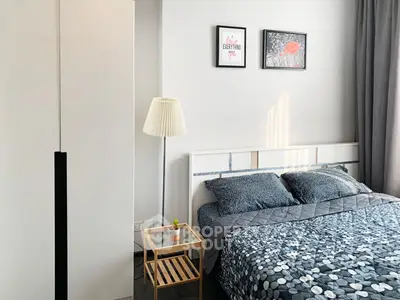 Cozy bedroom with modern decor and stylish furnishings, perfect for relaxation and comfort.