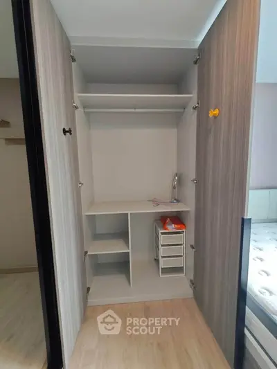 Spacious built-in wardrobe with ample storage in modern bedroom