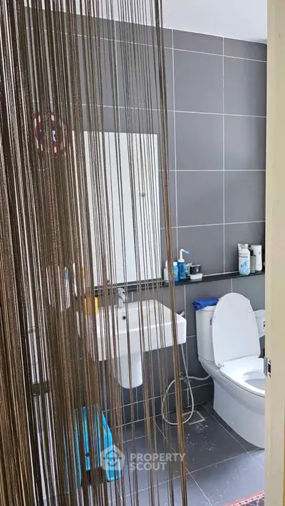 Modern bathroom with sleek design and contemporary fixtures in a stylish apartment.