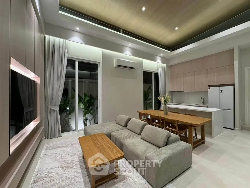 Luxurious open-plan living room with modern kitchen and elegant decor