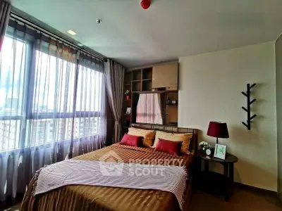 Cozy bedroom with large windows and stylish decor in modern apartment