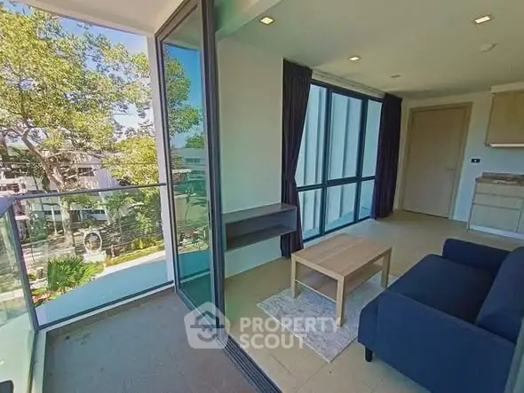 Modern living room with glass balcony and scenic view