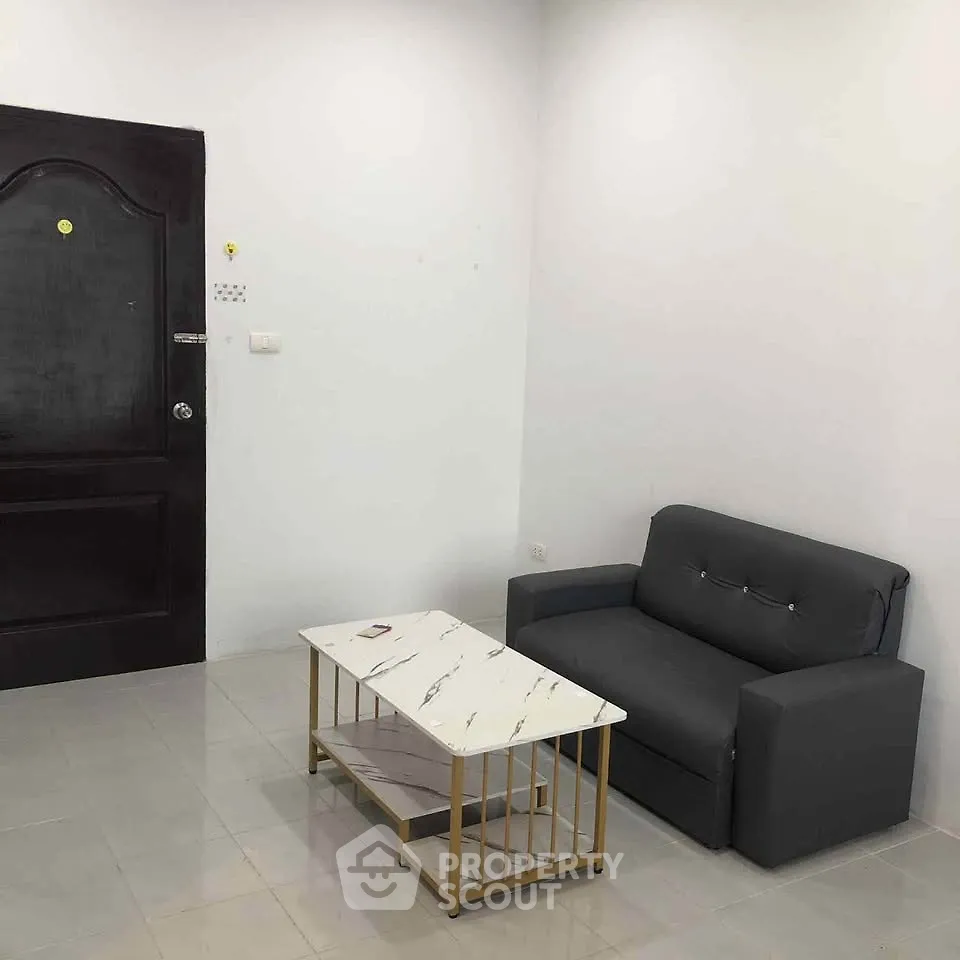 Minimalist living room with modern sofa and marble coffee table