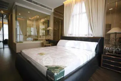 Luxurious bedroom with elegant decor and large windows in modern apartment