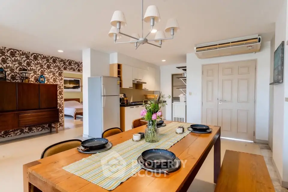 Charming open-layout dining area with modern kitchen and cozy decor