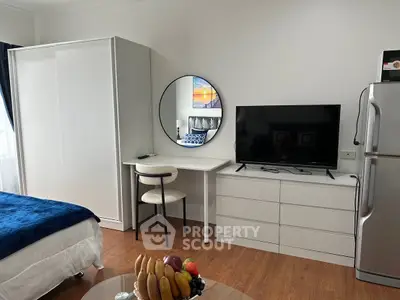 Modern studio apartment with sleek furniture and cozy ambiance