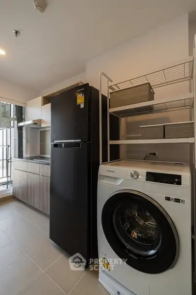 Modern kitchen with sleek appliances and ample storage space