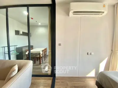 Modern apartment interior with glass partition and air conditioning