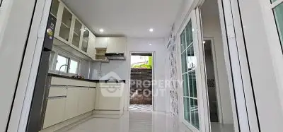 Modern kitchen with sleek cabinetry and open layout design