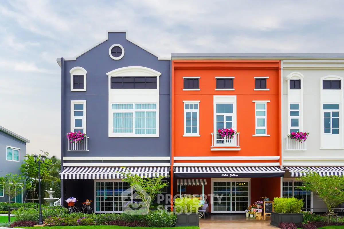 Charming colorful townhouses with vibrant facades and lush landscaping.