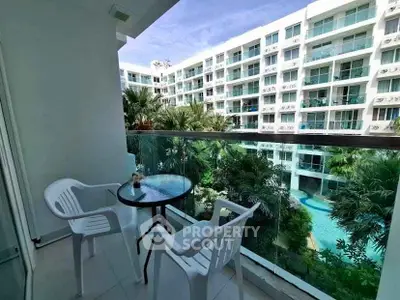 Modern balcony with pool view in luxury apartment complex