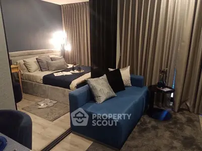 Modern bedroom with stylish decor and cozy seating area