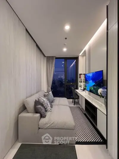 Modern living room with sleek design and city view, featuring a cozy sofa and large TV.
