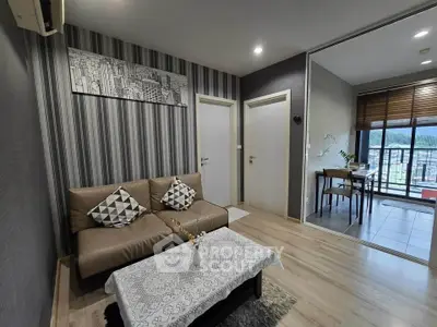 Modern living room with stylish decor and balcony view