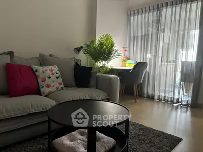 Cozy living room with modern decor and natural light from large window