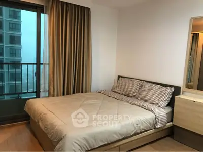 Cozy bedroom with balcony view in modern apartment