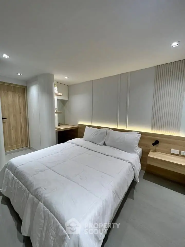 Modern bedroom with elegant lighting and cozy decor