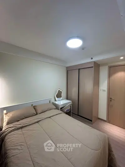 Cozy bedroom with modern furniture and ample storage space