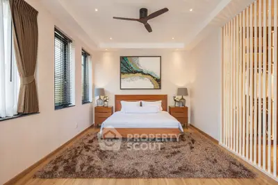 Spacious modern bedroom with elegant decor and natural light