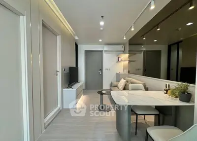 Modern living room with sleek design and cozy seating area