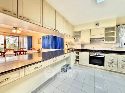 Spacious kitchen with modern appliances and ample storage in a bright, open layout.
