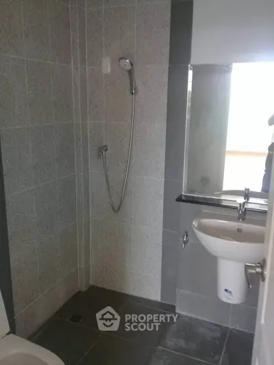 Modern bathroom with sleek shower and elegant sink design