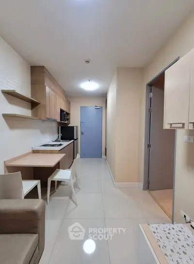 Modern compact apartment with open kitchen and dining area