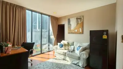Modern living room with large windows and stylish decor in urban apartment