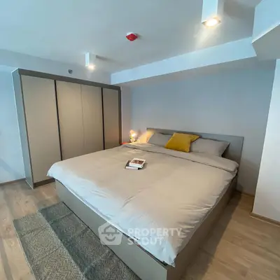 Spacious modern bedroom with cozy lighting and stylish decor