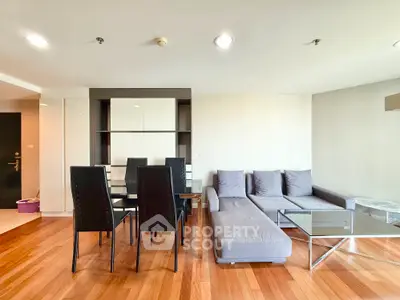 Modern living room with sleek furniture and wooden flooring