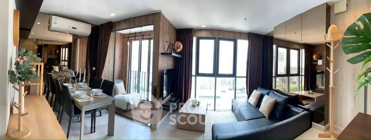 Spacious modern living room with dining area and balcony view