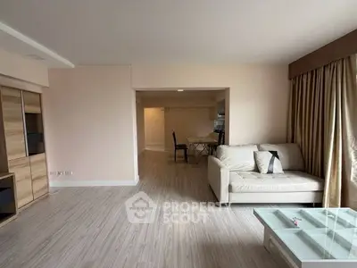 Spacious living room with modern decor and natural light