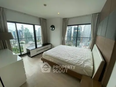 Spacious bedroom with stunning city view and modern furnishings