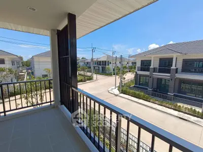 Spacious balcony with scenic neighborhood view in modern residential area