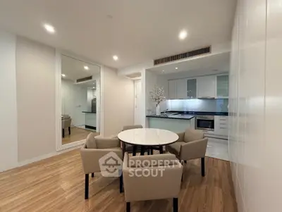 Modern dining area with elegant table and chairs in open kitchen layout