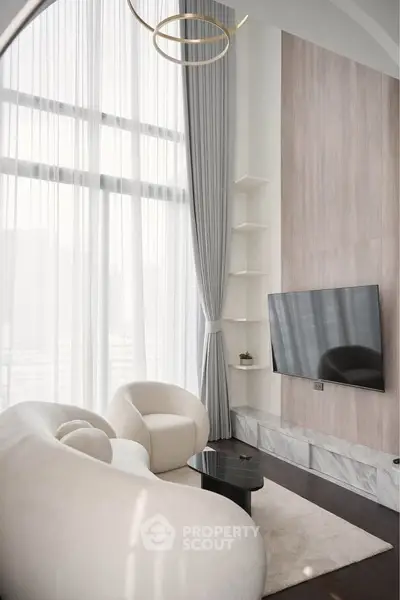 Luxurious modern living room with high ceilings and elegant furniture