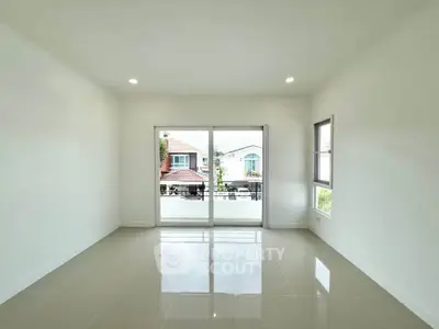 Spacious empty room with large windows and glossy tiled floor