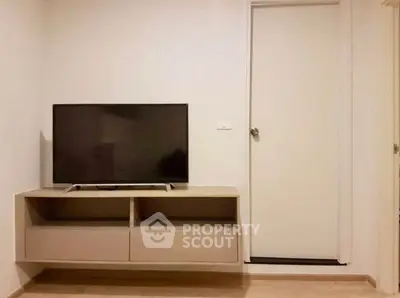 Modern living room with sleek TV unit and minimalist design