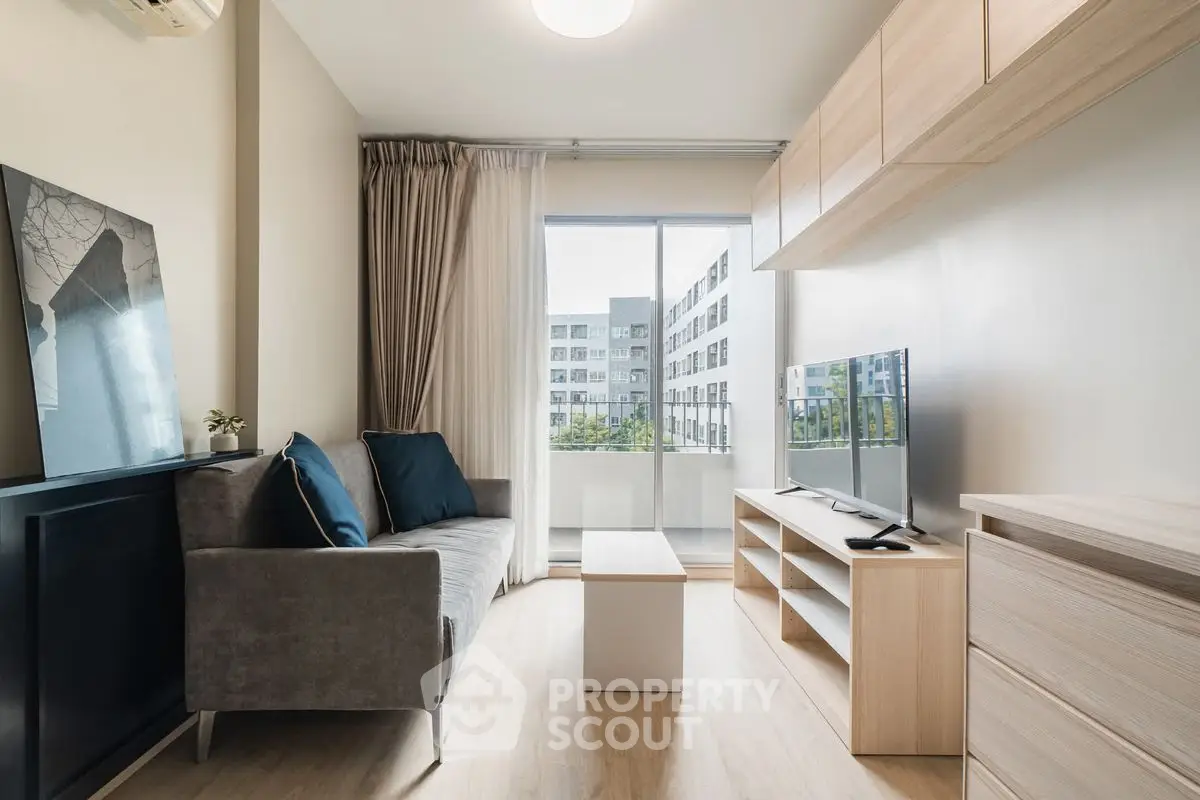 Modern living room with sleek furniture and large window view
