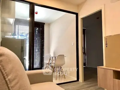 Modern apartment interior with cozy seating and stylish dining area.