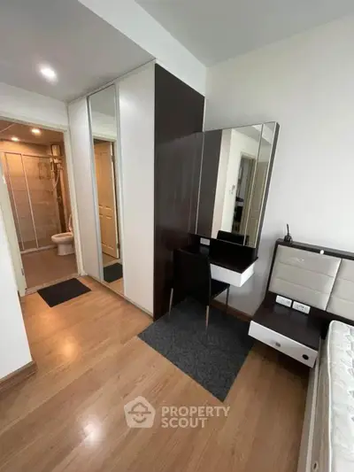 Modern bedroom with sleek design and built-in wardrobe