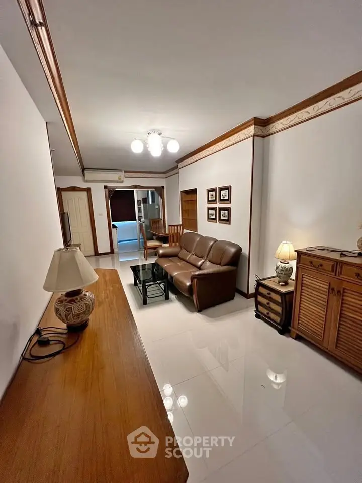 Spacious living room with elegant decor and comfortable seating in a modern apartment.
