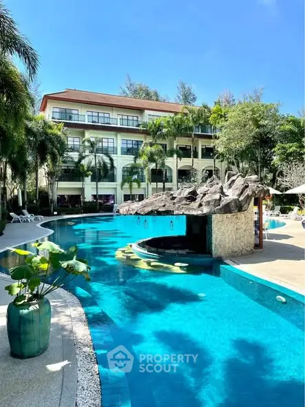 Luxurious resort-style pool with lush greenery and elegant architecture