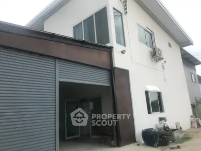 Modern two-story house with garage and air conditioning unit