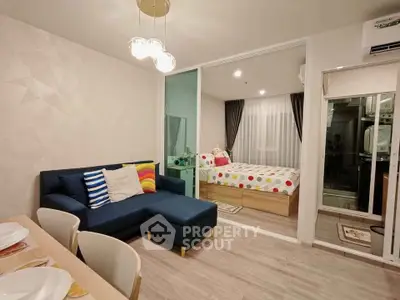 Modern open-plan living room with cozy bedroom and stylish decor