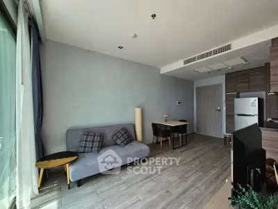 Modern living room with sleek furniture and natural light, perfect for urban living.